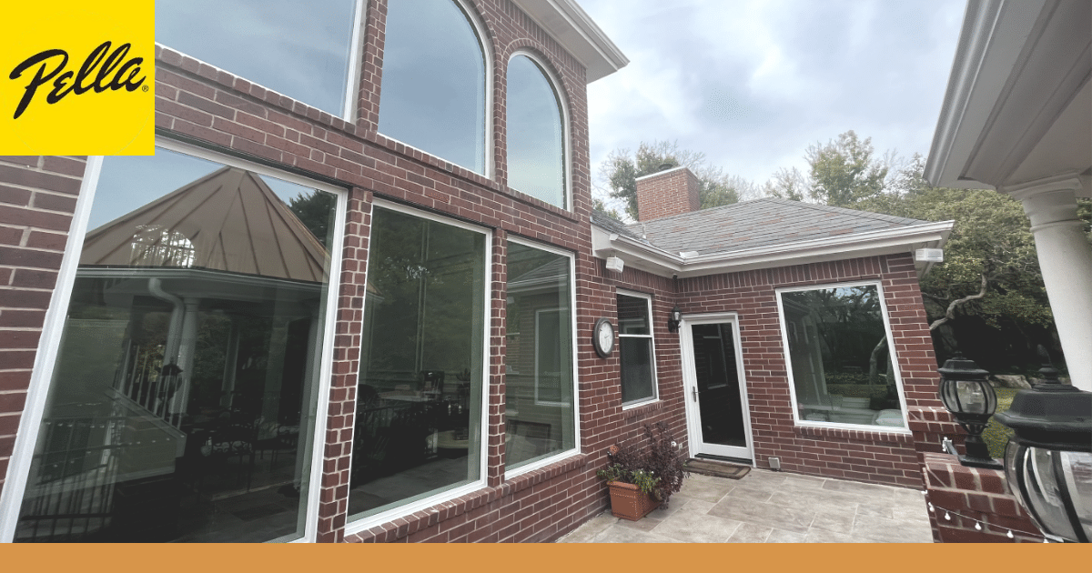 large Pella windows on a brick house back patio